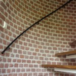 gesmede leuning op een spiltrap gesmede leuning op een spiltrap